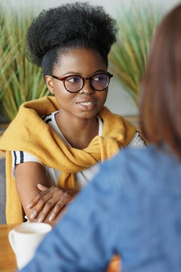 moral support and mental health, an African-American woman supporting a colleague in a difficult